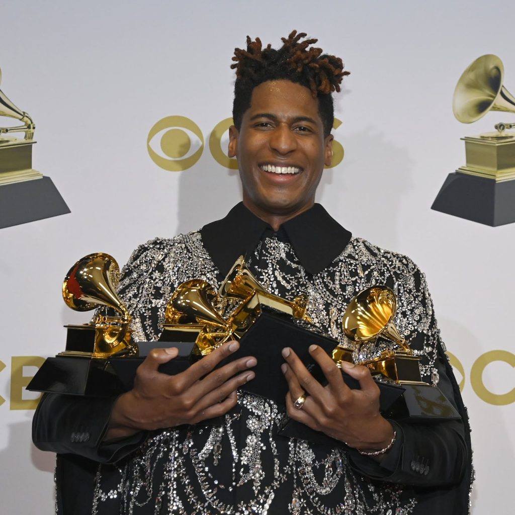 John Baptiste holding his Grammy Awards